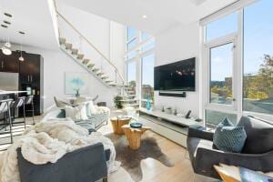 living room featuring plenty of natural light and light wood-type flooring