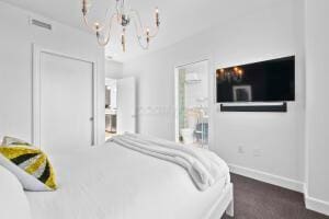 bedroom featuring a chandelier