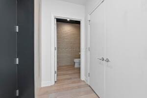 hallway with light wood-type flooring