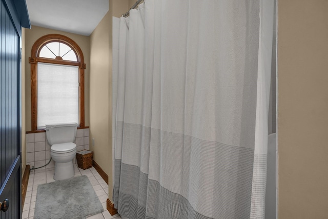 bathroom featuring tile patterned floors and toilet