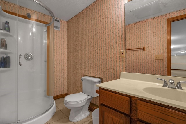 bathroom with tile patterned floors, toilet, an enclosed shower, a textured ceiling, and vanity