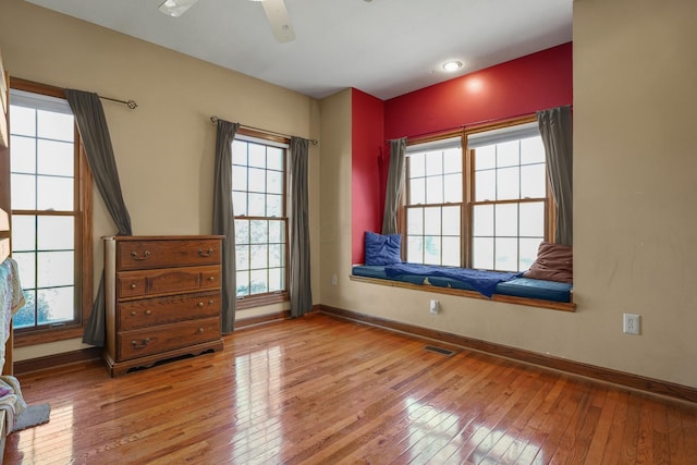 spare room featuring ceiling fan and light wood-type flooring