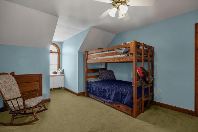 carpeted bedroom featuring lofted ceiling and ceiling fan