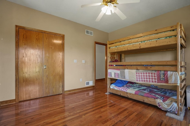 bedroom featuring wood-type flooring and ceiling fan