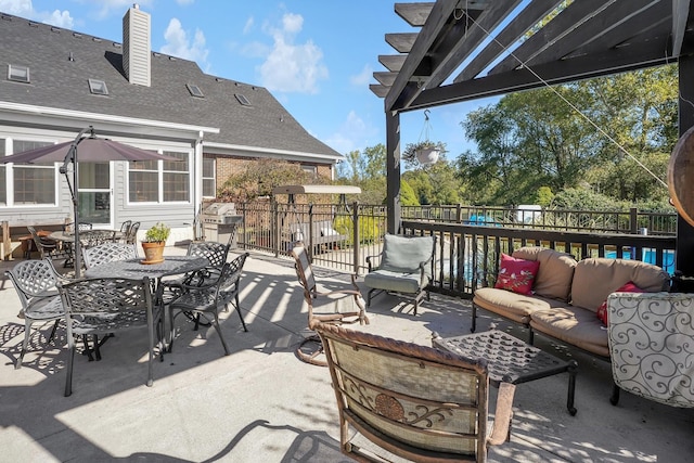 view of patio featuring an outdoor hangout area and a pergola