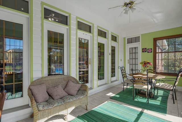 sunroom / solarium featuring ceiling fan