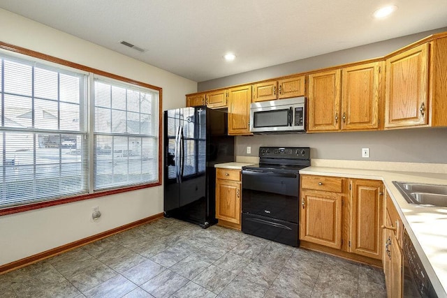 kitchen with sink and black appliances