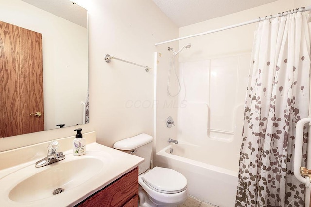 full bathroom with vanity, shower / bath combo, and toilet