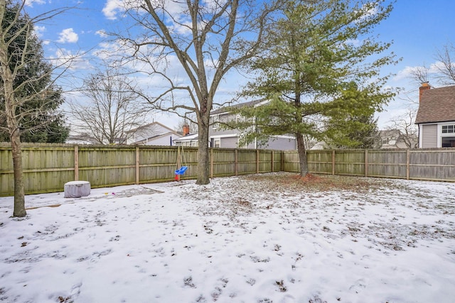 view of yard layered in snow