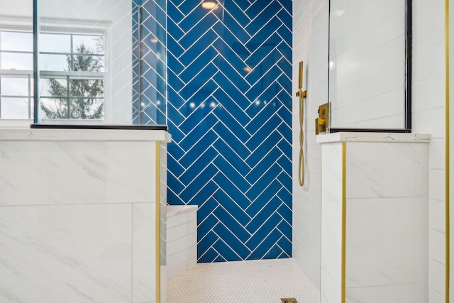 bathroom with tiled shower