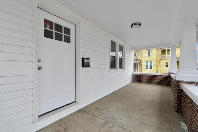 doorway to property with a porch