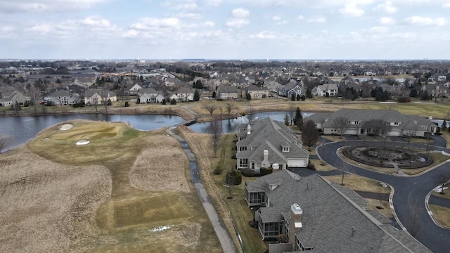 birds eye view of property with a water view and a residential view