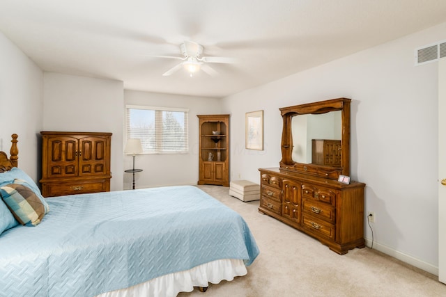 bedroom with a ceiling fan, visible vents, light carpet, and baseboards