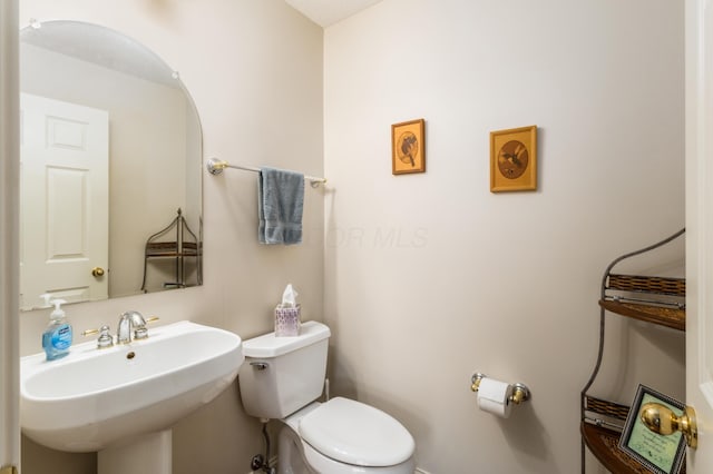 bathroom with a sink and toilet