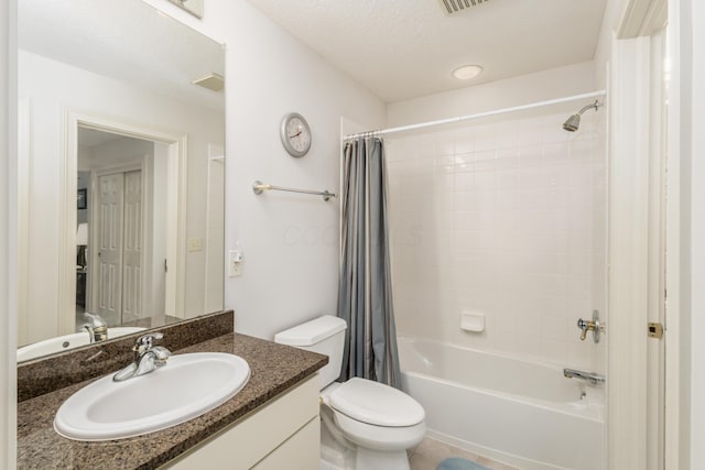 bathroom with shower / tub combo, visible vents, vanity, and toilet