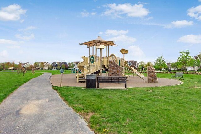 community play area featuring a lawn