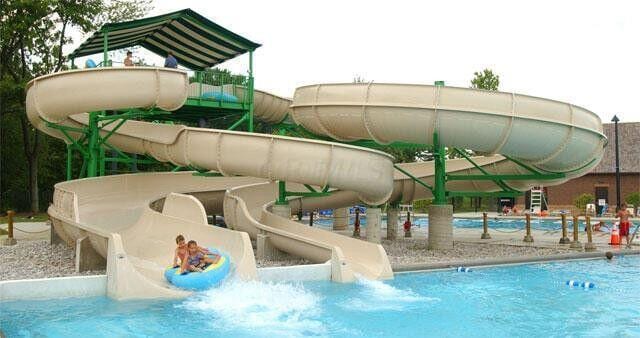 view of play area with a water play area and a community pool