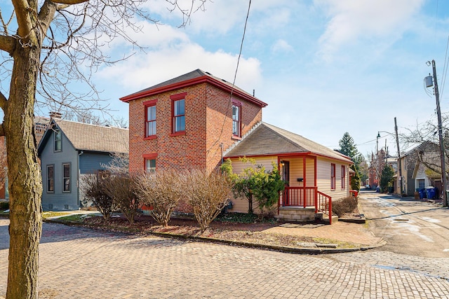 view of front of house with brick siding