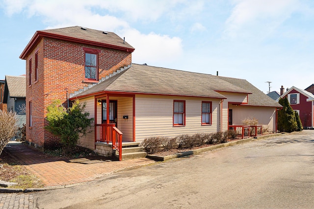 traditional-style house featuring brick siding