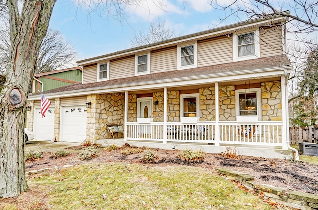 view of front of house featuring a garage and covered porch