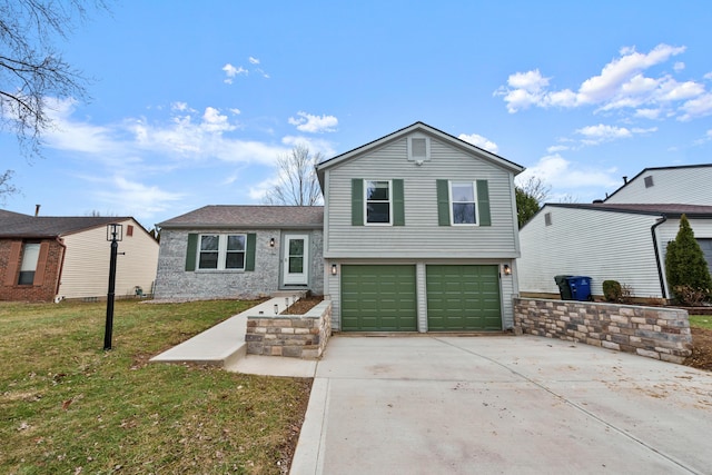 split level home featuring a garage and a front yard