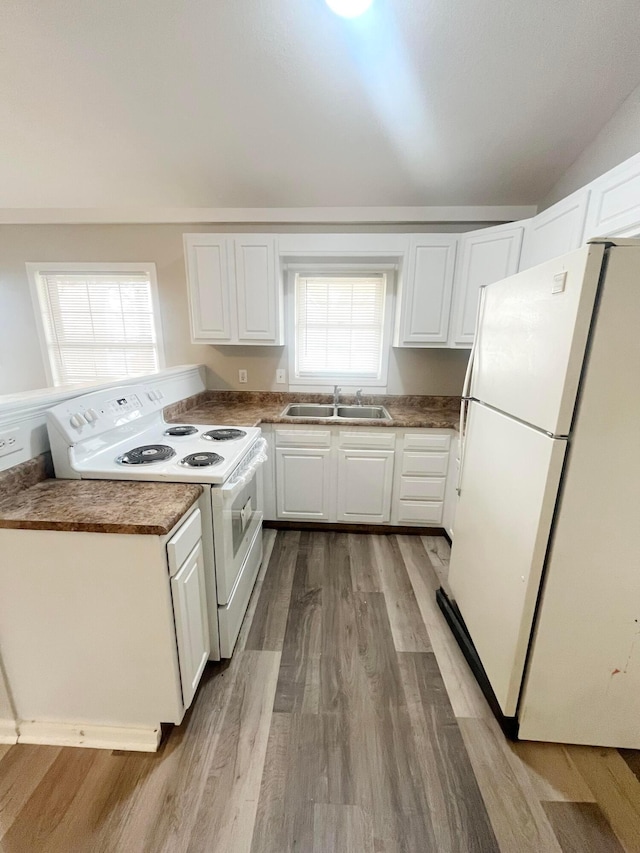 kitchen featuring white cabinetry, white appliances, sink, and light hardwood / wood-style flooring