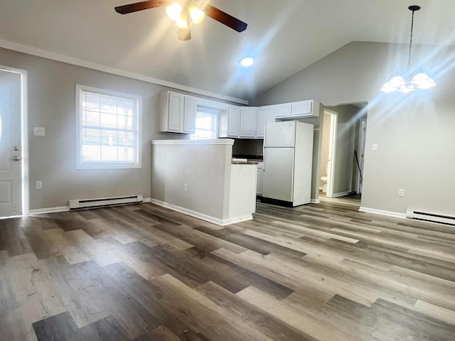 kitchen featuring pendant lighting, white cabinetry, white refrigerator, hardwood / wood-style flooring, and baseboard heating