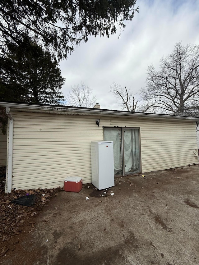 back of property featuring a patio area