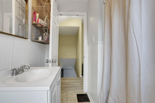 bathroom featuring tile patterned flooring and vanity