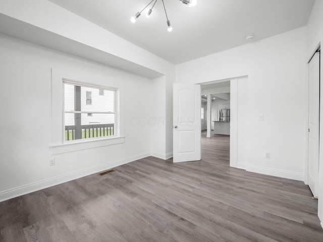 empty room featuring wood-type flooring