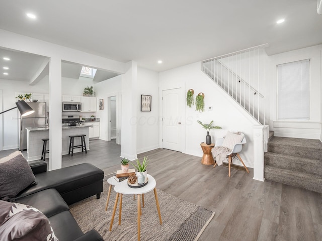 living room with light hardwood / wood-style flooring