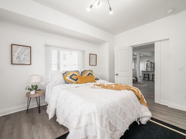 bedroom featuring dark wood-type flooring