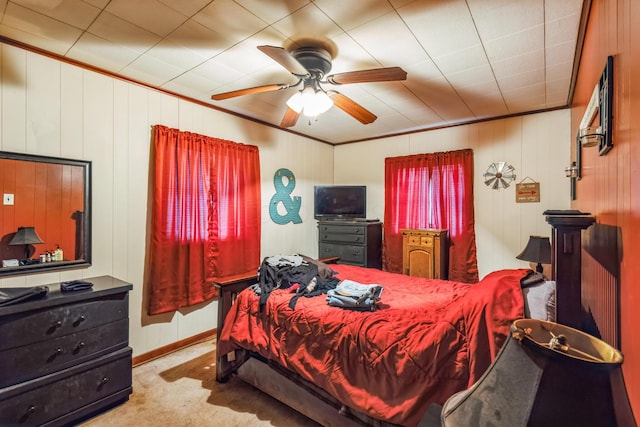 bedroom with ceiling fan, light colored carpet, and ornamental molding