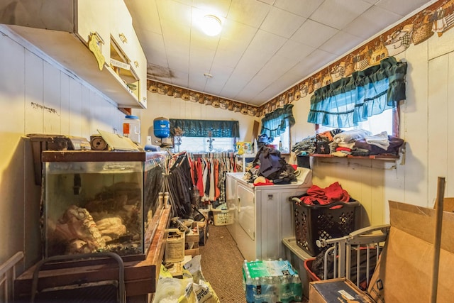 miscellaneous room featuring washing machine and dryer and lofted ceiling