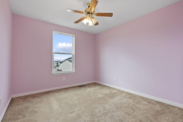 carpeted empty room with ceiling fan