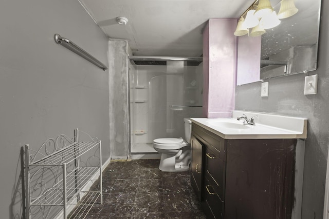 bathroom featuring walk in shower, vanity, and toilet