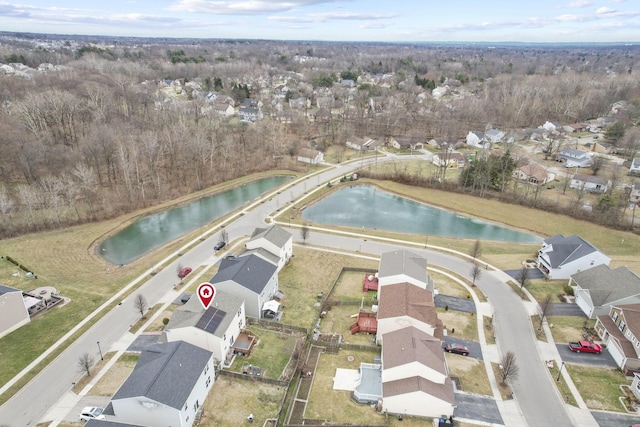 bird's eye view with a water view