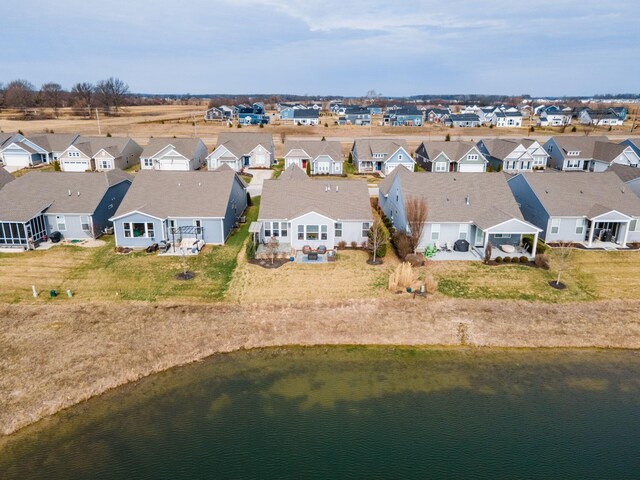 birds eye view of property featuring a residential view and a water view