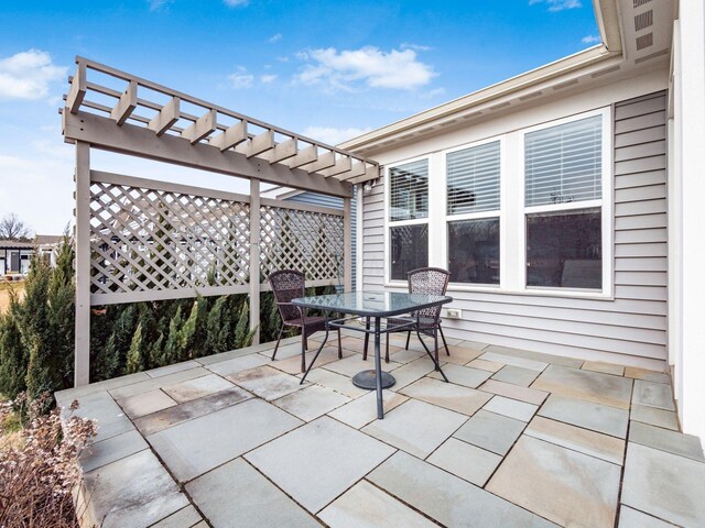 view of patio / terrace featuring outdoor dining space and a pergola