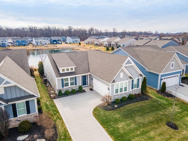 aerial view featuring a residential view and a water view