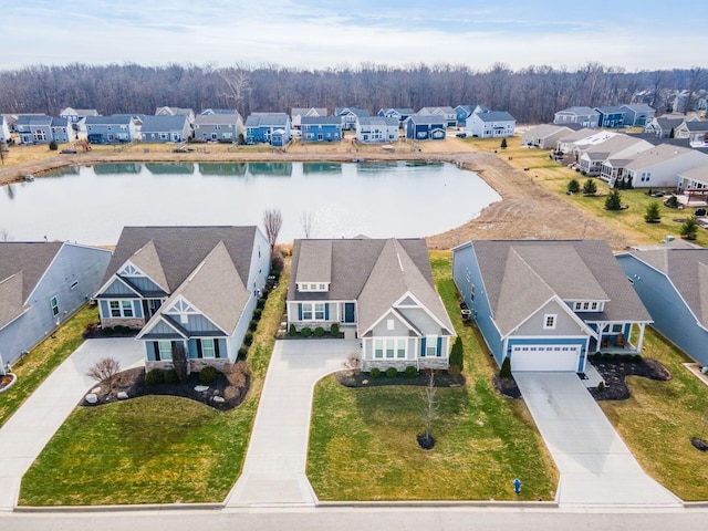 drone / aerial view featuring a water view and a residential view