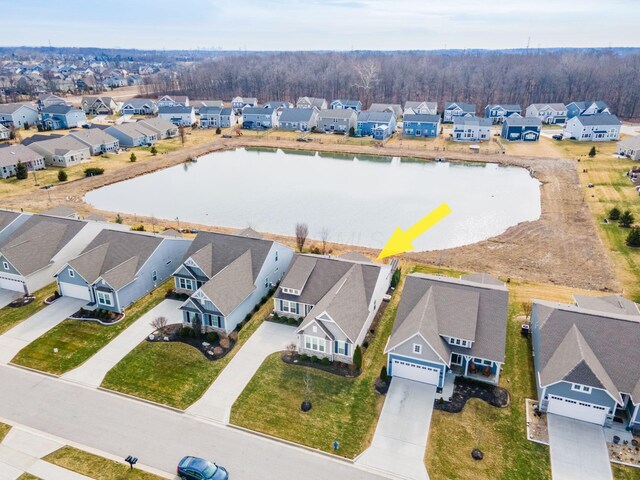 aerial view featuring a residential view and a water view