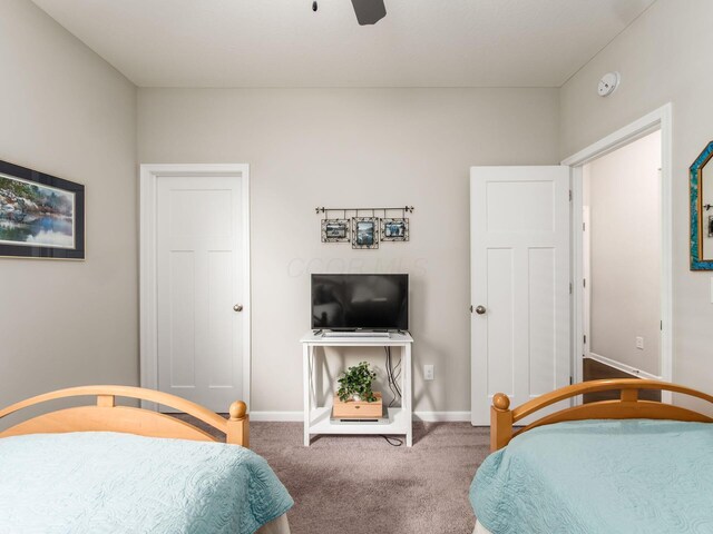 bedroom with carpet floors, ceiling fan, and baseboards