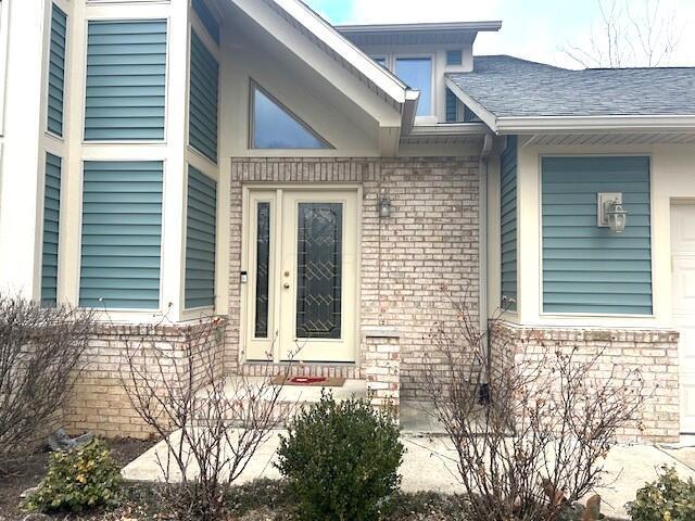 property entrance featuring a garage