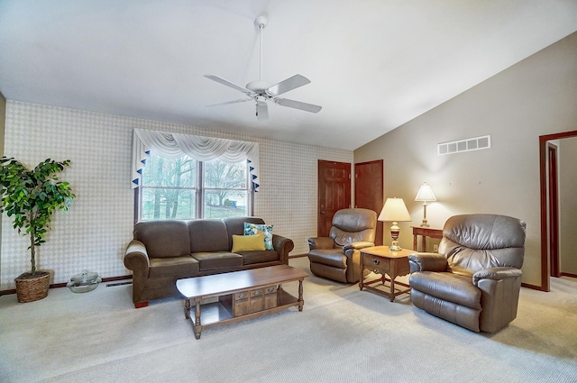 living area with wallpapered walls, baseboards, visible vents, light colored carpet, and vaulted ceiling