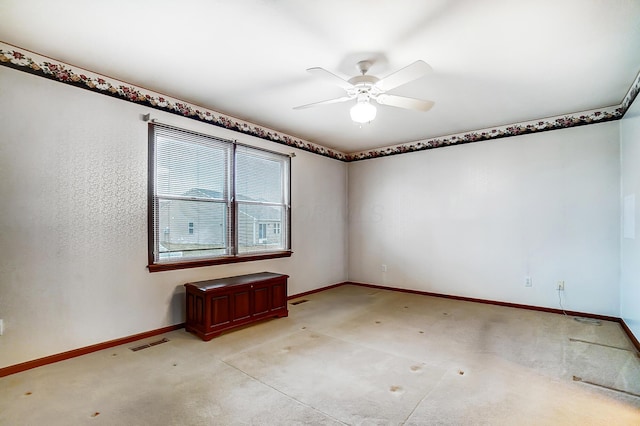 spare room with visible vents, ceiling fan, light carpet, and baseboards