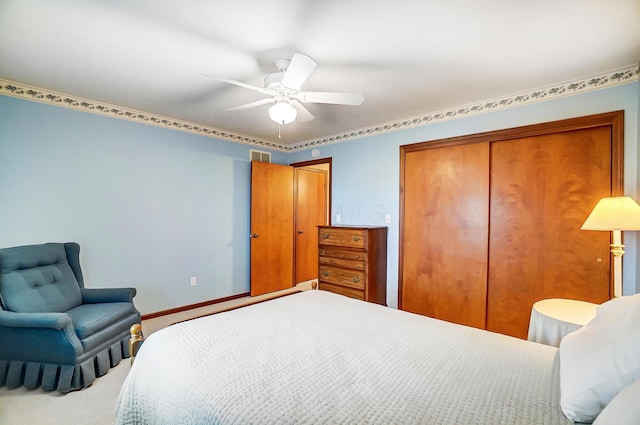 carpeted bedroom with ceiling fan, visible vents, baseboards, and a closet