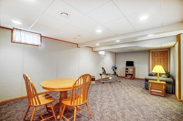 carpeted dining space with a paneled ceiling, baseboards, and recessed lighting