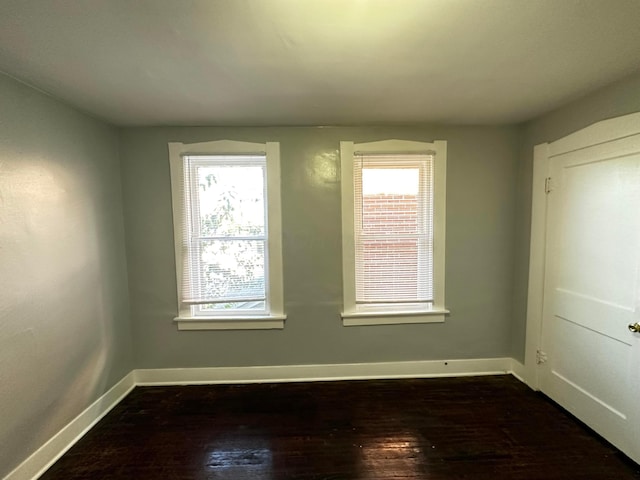 1249-1251 E 15th Ave, Columbus, OH 43211 - spare room featuring baseboards and dark wood-style flooring