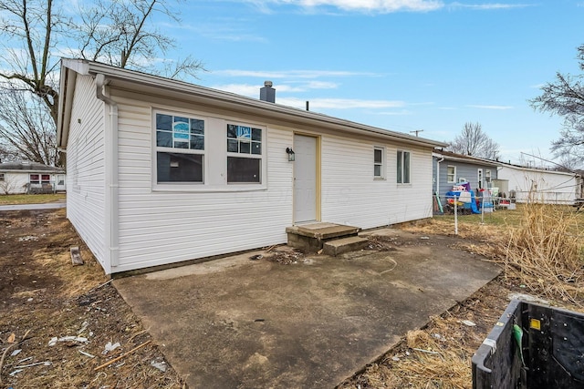 back of property with a patio